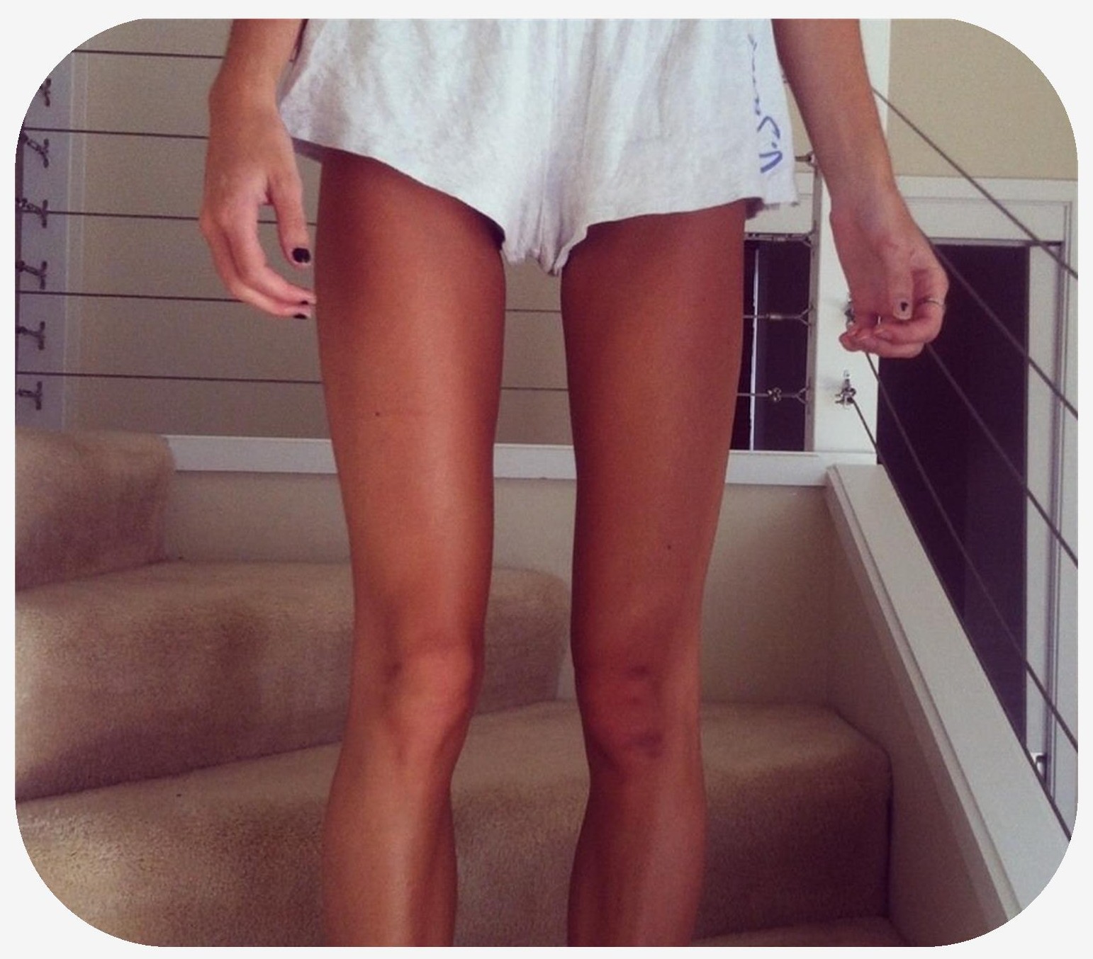 Woman with a thigh gap standing on stairs