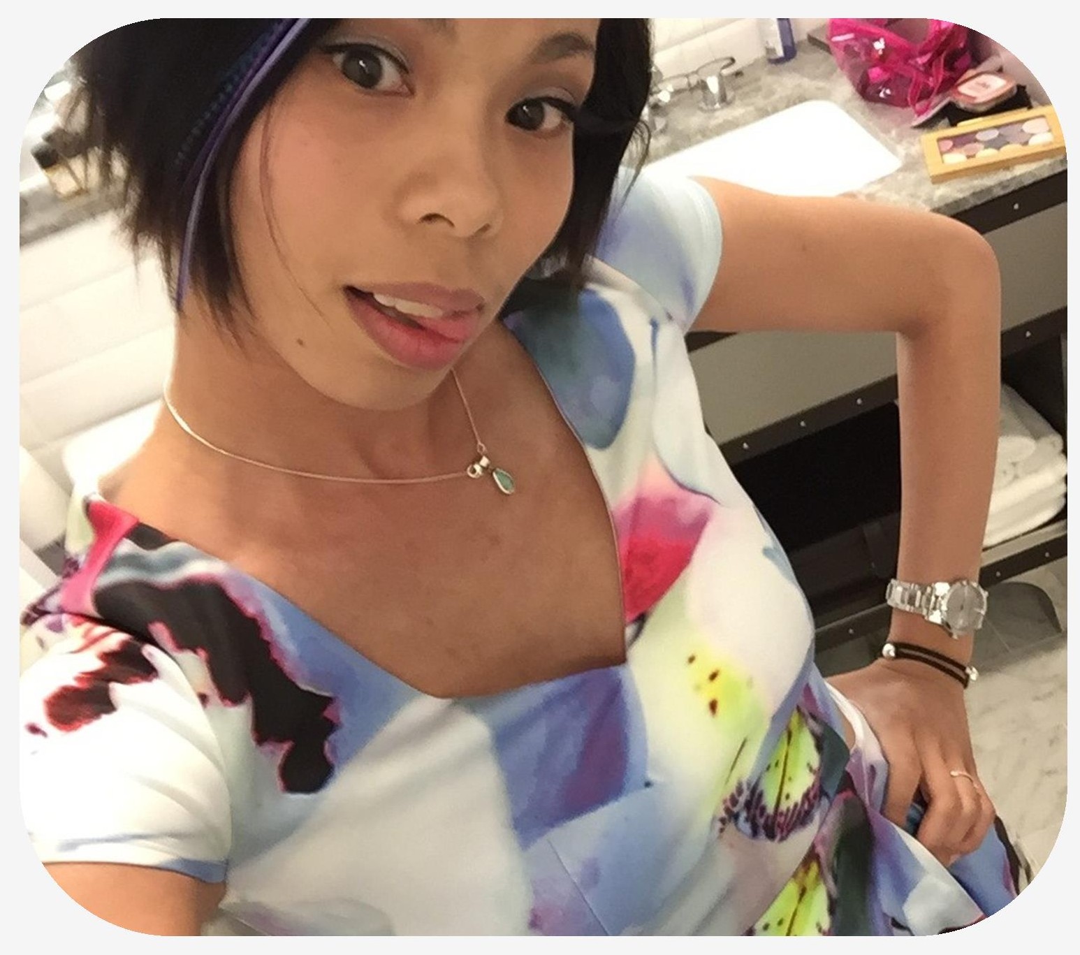 Woman in a colorful dress with hair accents