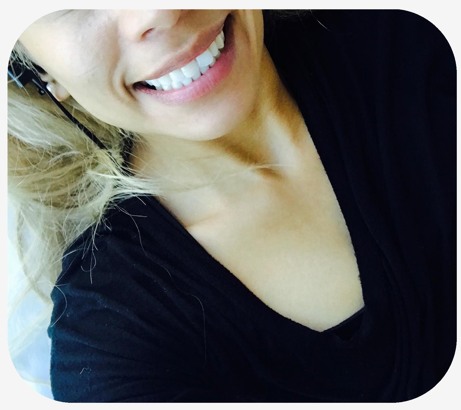 Womans wearing black with bright white teeth