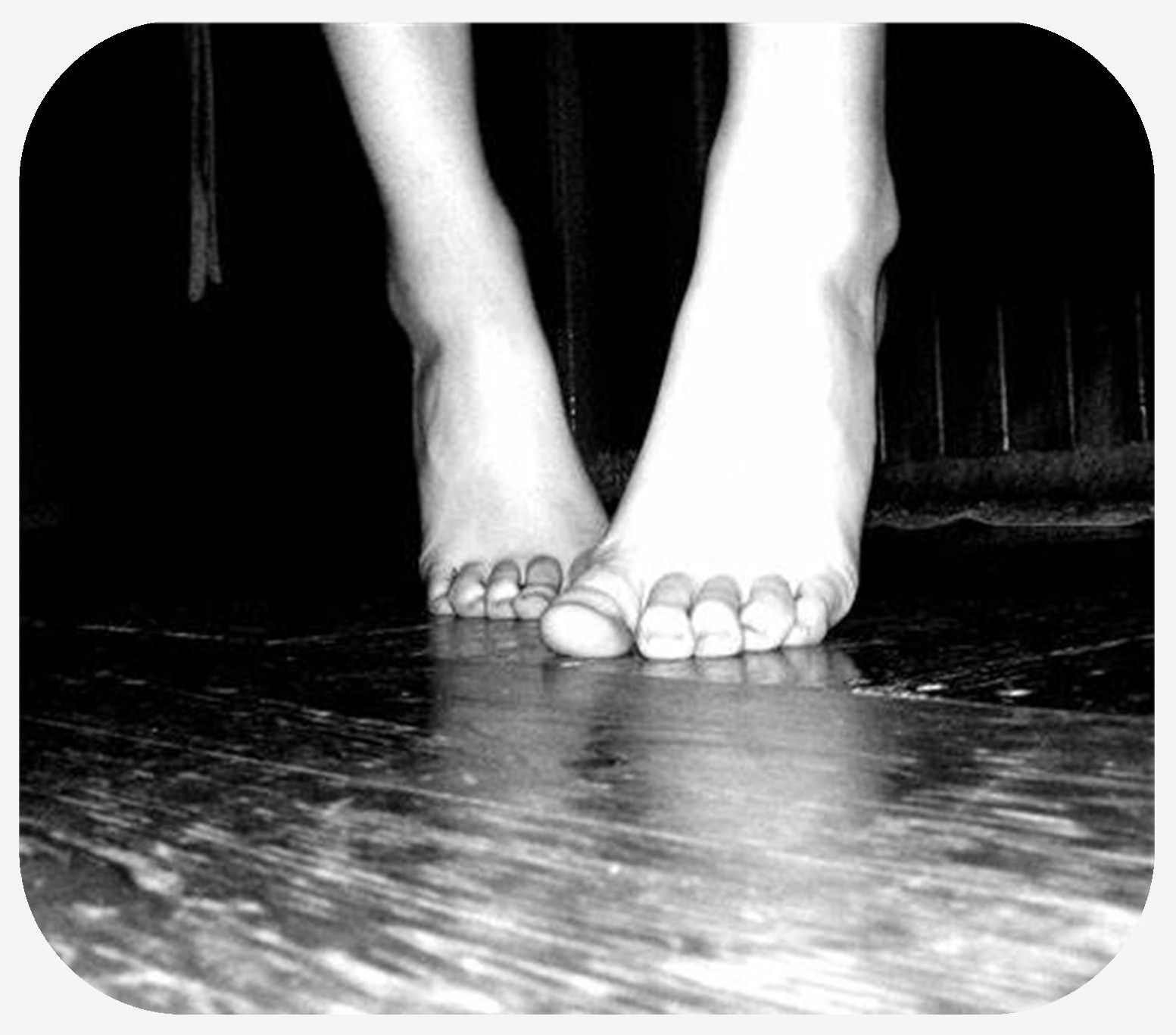 Female quietly walking on her toes in the low lighting