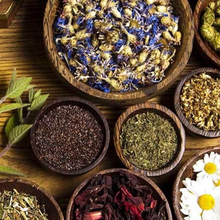 Table filed with bowls of various herbs
