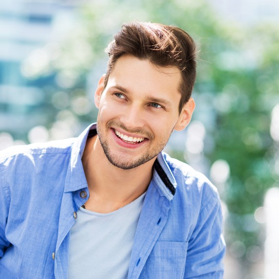 Man who is smiling outside
