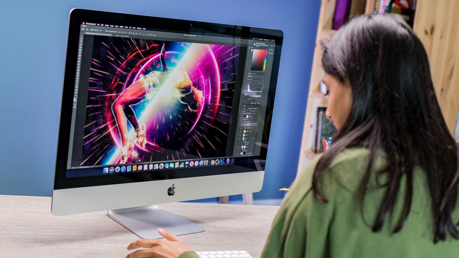 Female on an iMac with a graphic design task open