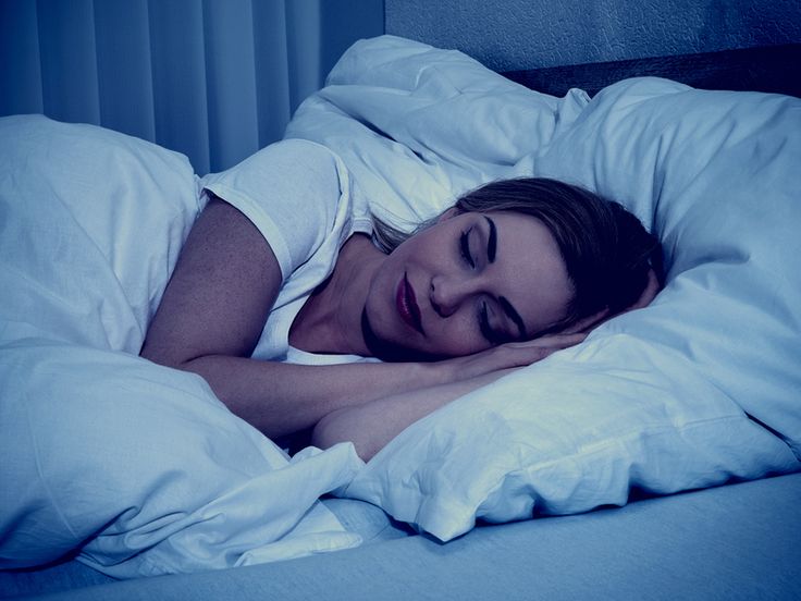 Woman sleeping on bed